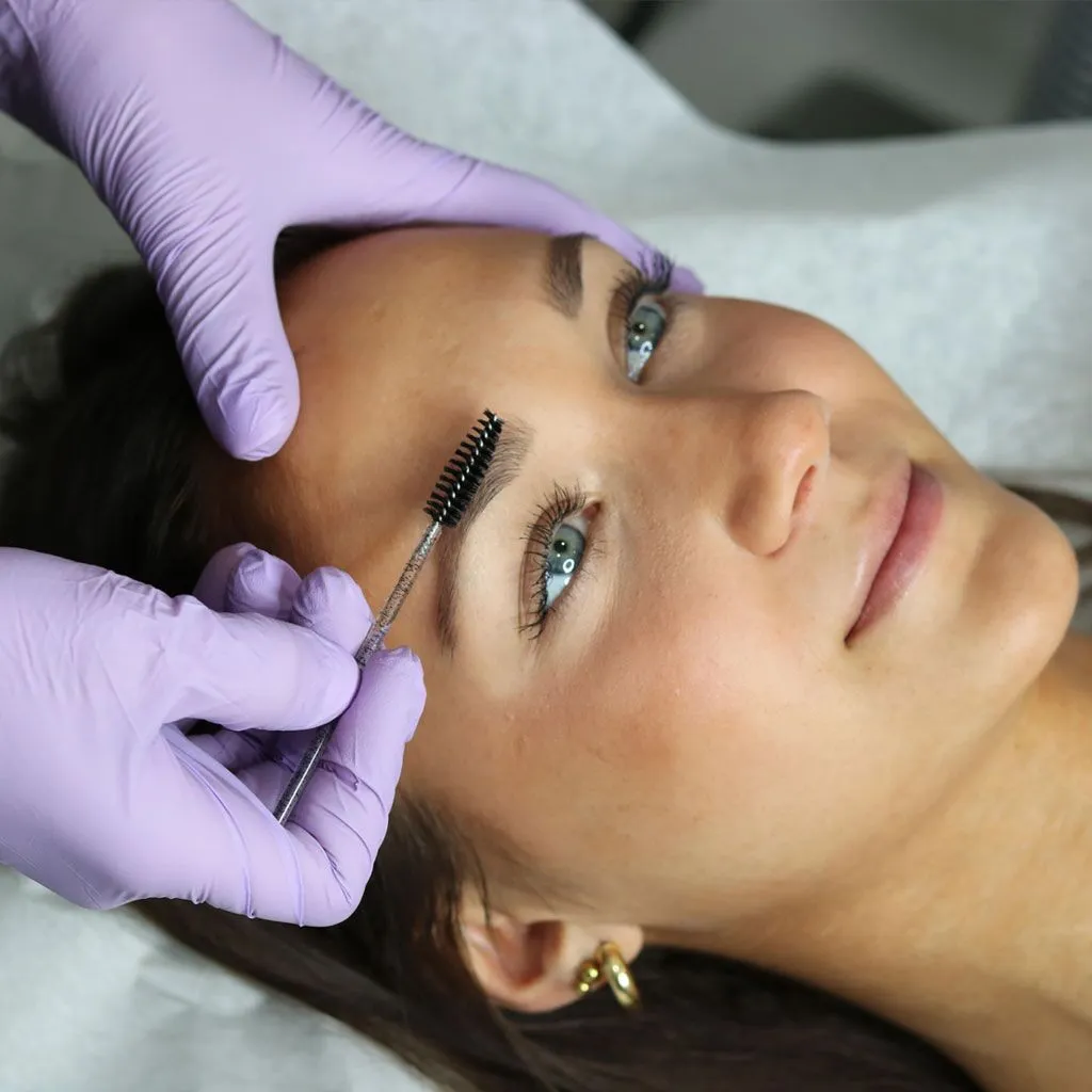 Photo of a beauty treatment focused on brows and lashes at Liv Aesthetics LLC in Thornwood, NY. A technician carefully applies product to the client’s eyelashes or eyebrows, emphasizing precision and enhancing natural features.